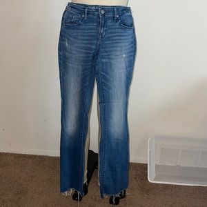 Mossimo Mid Rise Boot Cut Jean With Distressed Hem